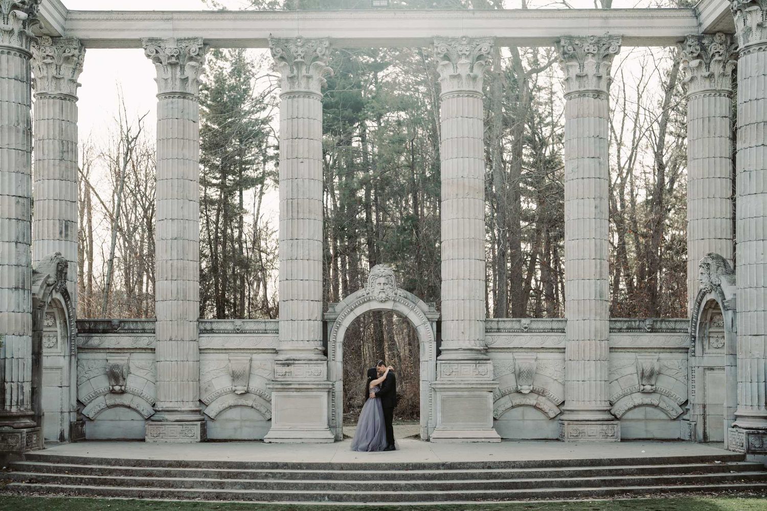 Classic engagement photo taken at Guild Inn Estate Toronto, highlighting romance with nature and vintage structures.