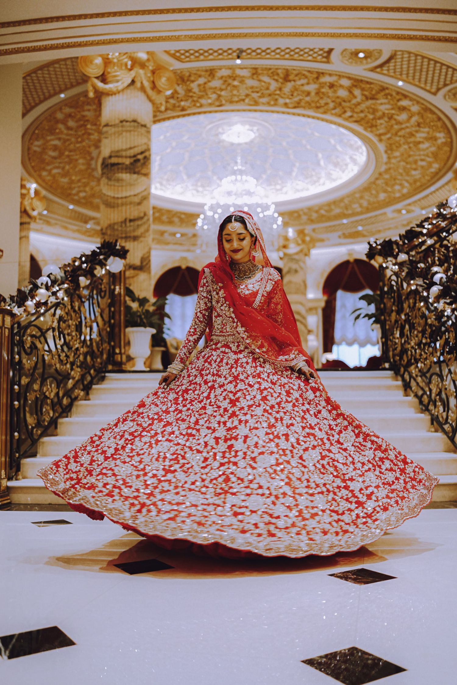 Whimsical engagement photo in front of the Palace Hotel in Dubai — elegance meets fairytale.