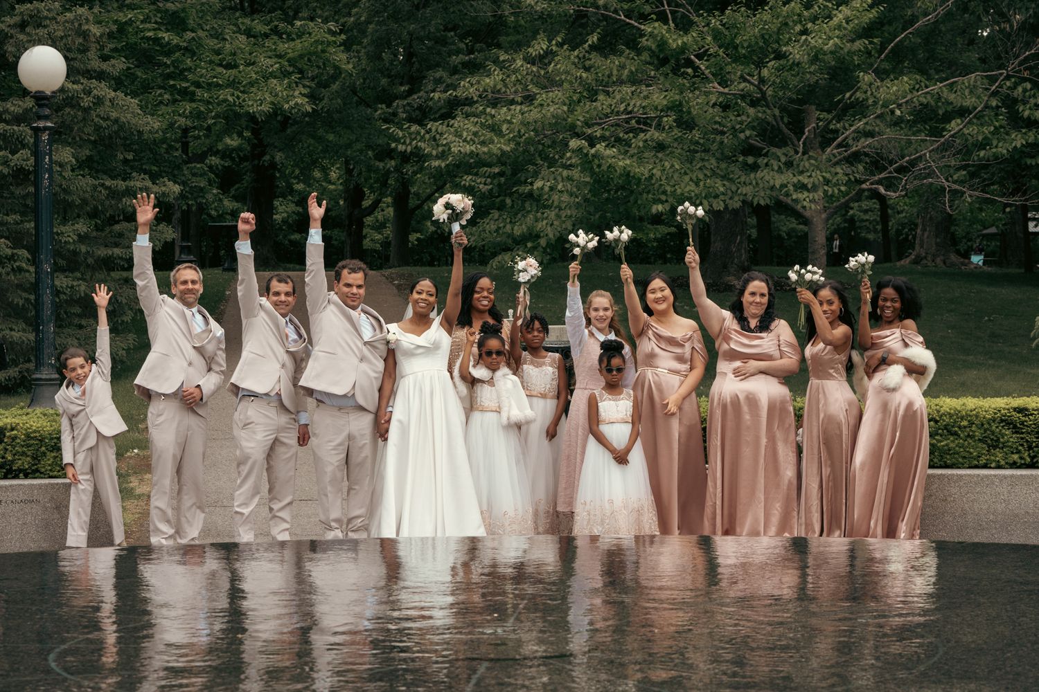 Heartfelt moment captured: bride and groom siblings, reflecting the deep love and tradition of white weddings in one group photo at ottawa.