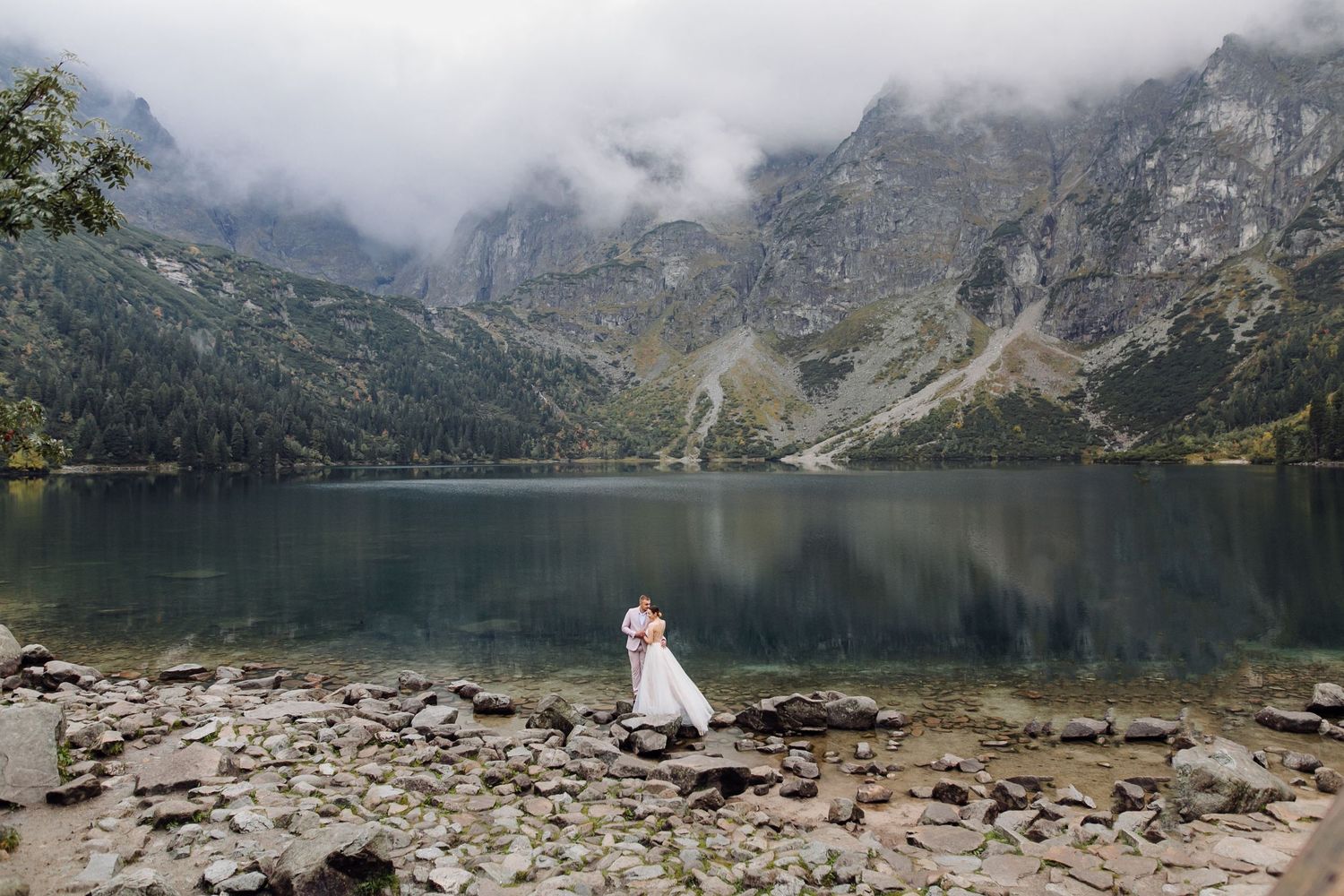 Epic mountain engagement portrait in Canada Vancover with the bride and groom flowing in the breeze.