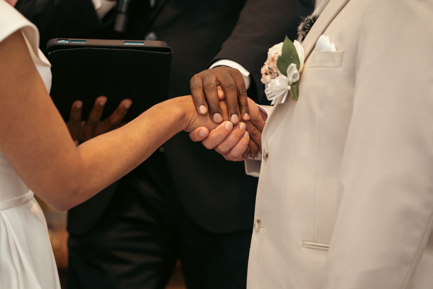 Heartfelt moment captured: uncle and aunt blessing the groom at the reception, reflecting the deep love and tradition of a white wedding