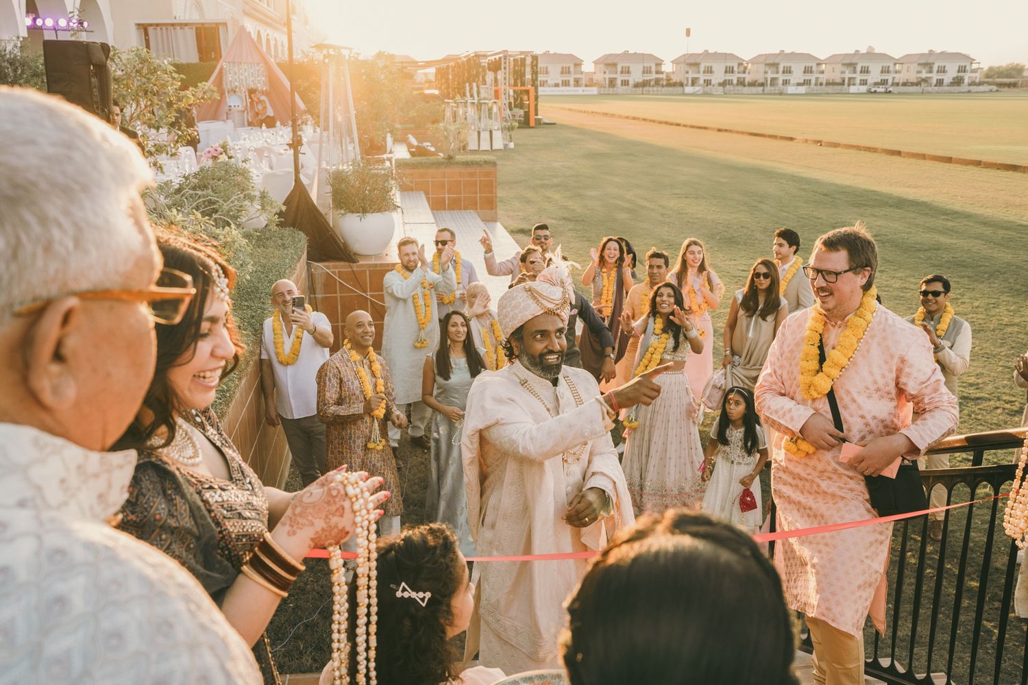Heartfelt moment captured: siblings laughing in haldi turmeric ceremony, reflecting the deep love and tradition of South Asian weddings.