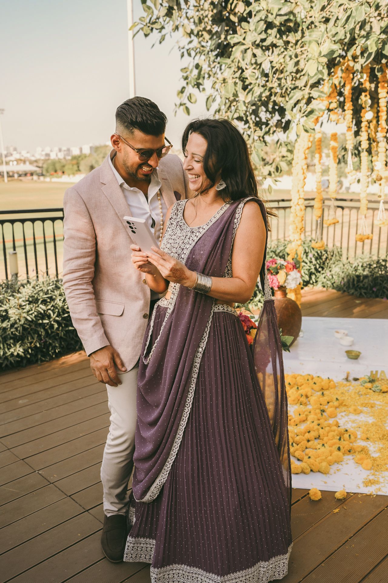 Candid shot of Pakistani groom whispering something to the bride during their reception at a Lahore banquet hall.