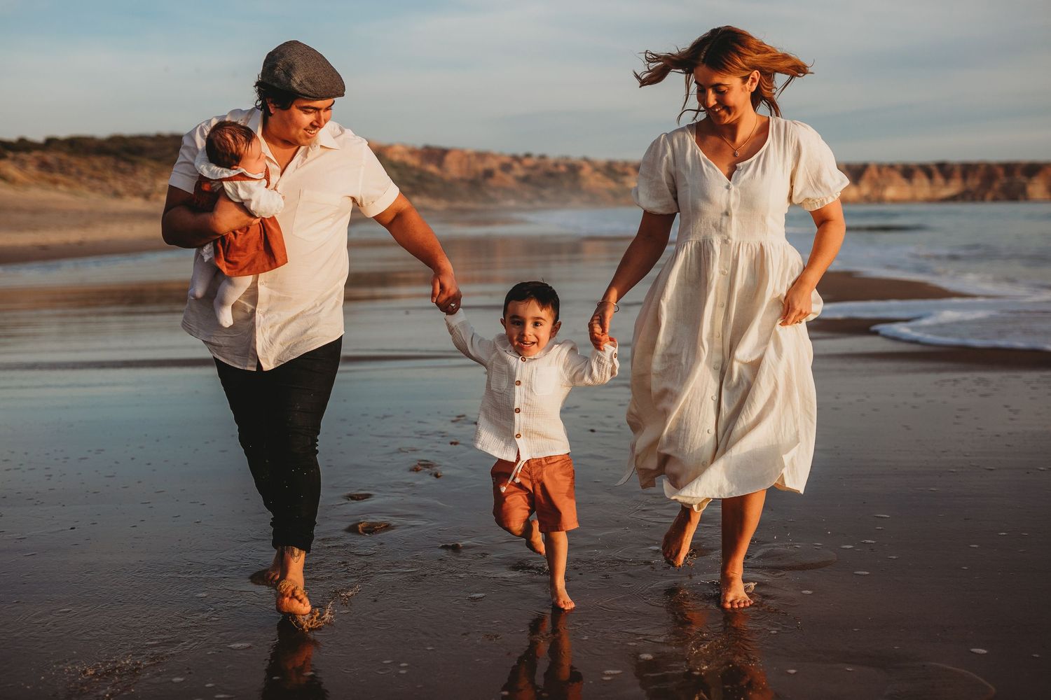 Family running along the beach at sunset in Adelaide, South Australia – Raised by Water Photography