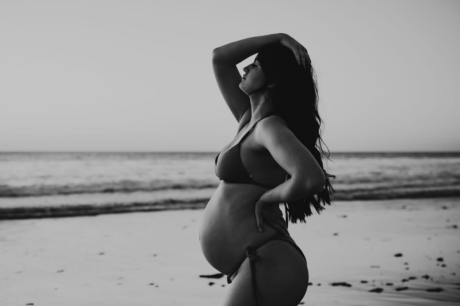 Black and white portrait of pregnant mum embracing baby bump – Raised by Water Photography, Adelaide