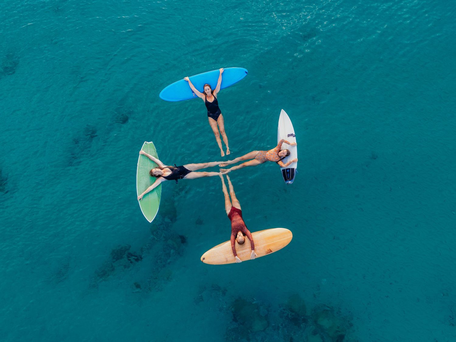 Group of women floating in ocean holding surfboards near Adelaide beach – Raised by Water Photography - She and the Wild Sea