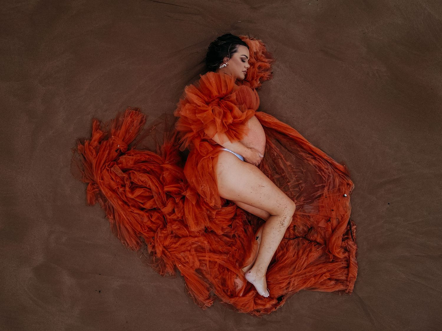 Drone shot of pregnant mum in dramatic gown. Maternity photographer Adelaide, South Australia