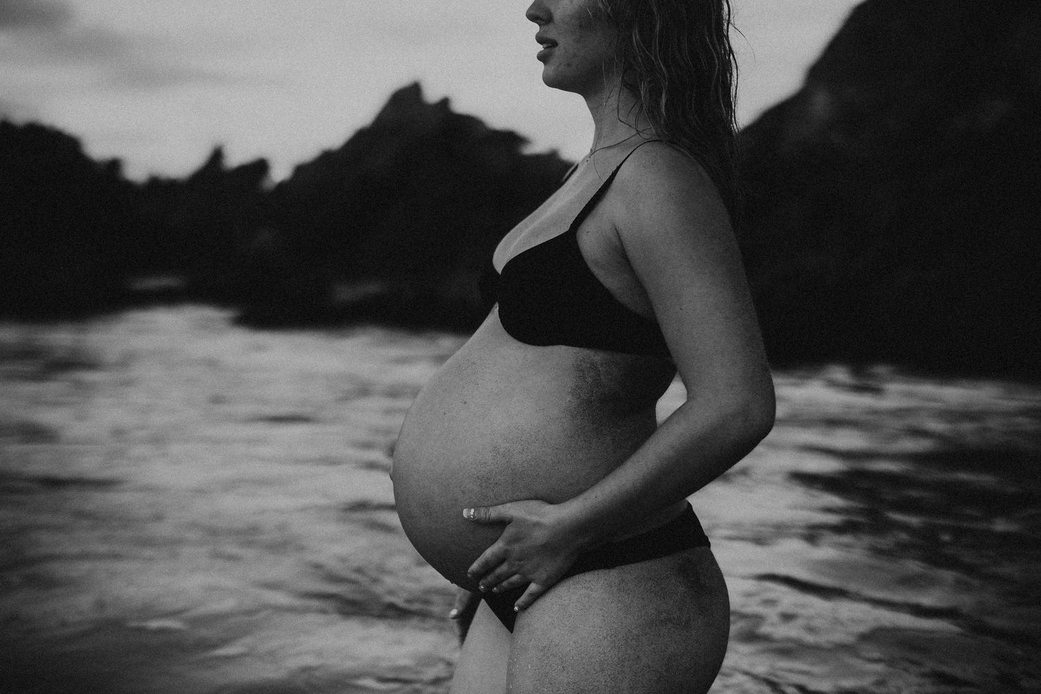 Classic black and white photograph focusing on pregnant belly curves – Adelaide maternity session