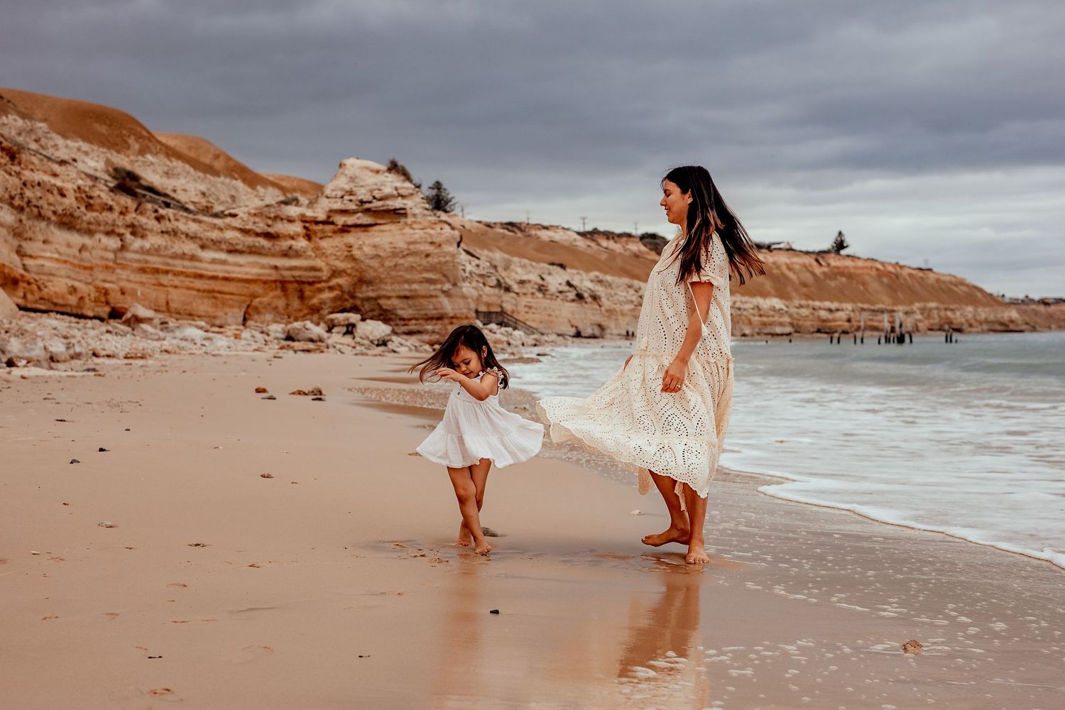 Mum and Daughter dancing on the beach on the Fleurieu peninsula, South Australia