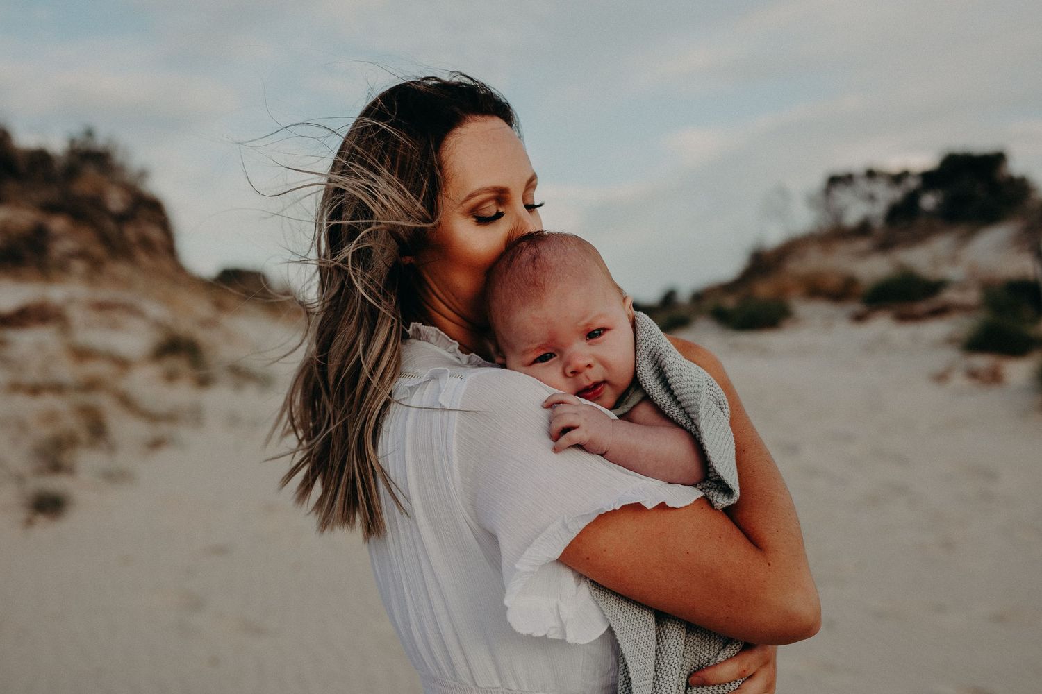 Mum embracing her baby.  Adelaide family and lifestyle photographer.