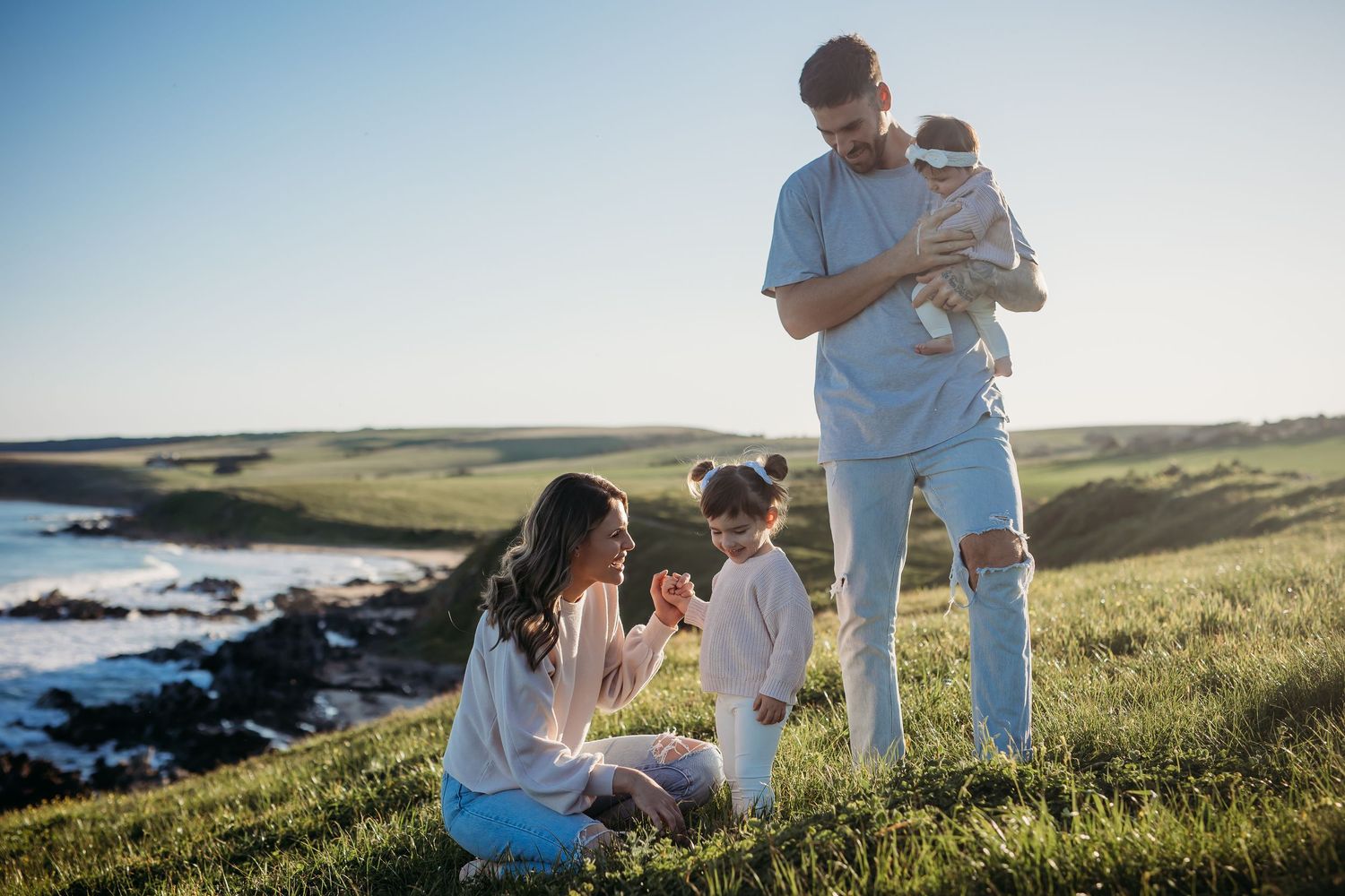 Adelaide family on a cliff oceanside. Adelaide family photographer - Raised by Water Photography