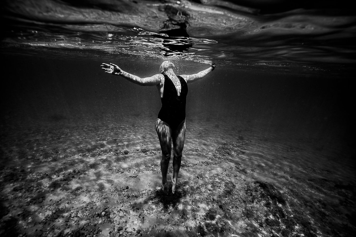Lady floating underwater - underwater photographer Adelaide, South Australia - Raised by Water Photography