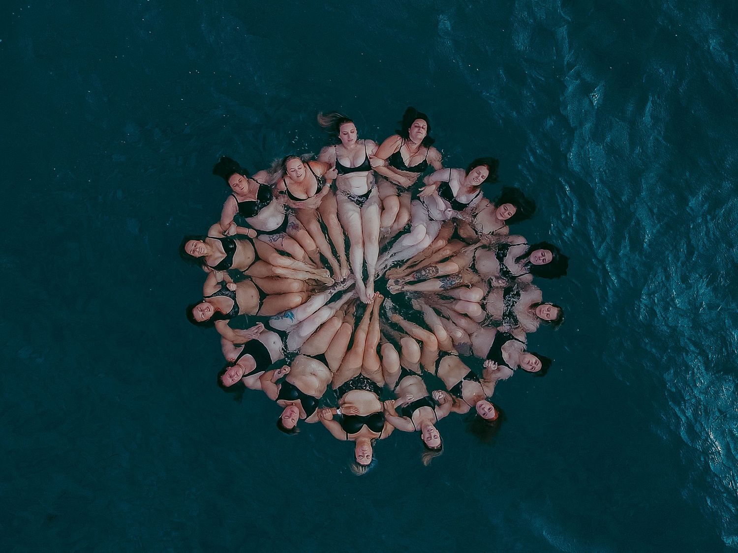 Group of women floating peacefully together in ocean near Adelaide – Raised by Water Photography