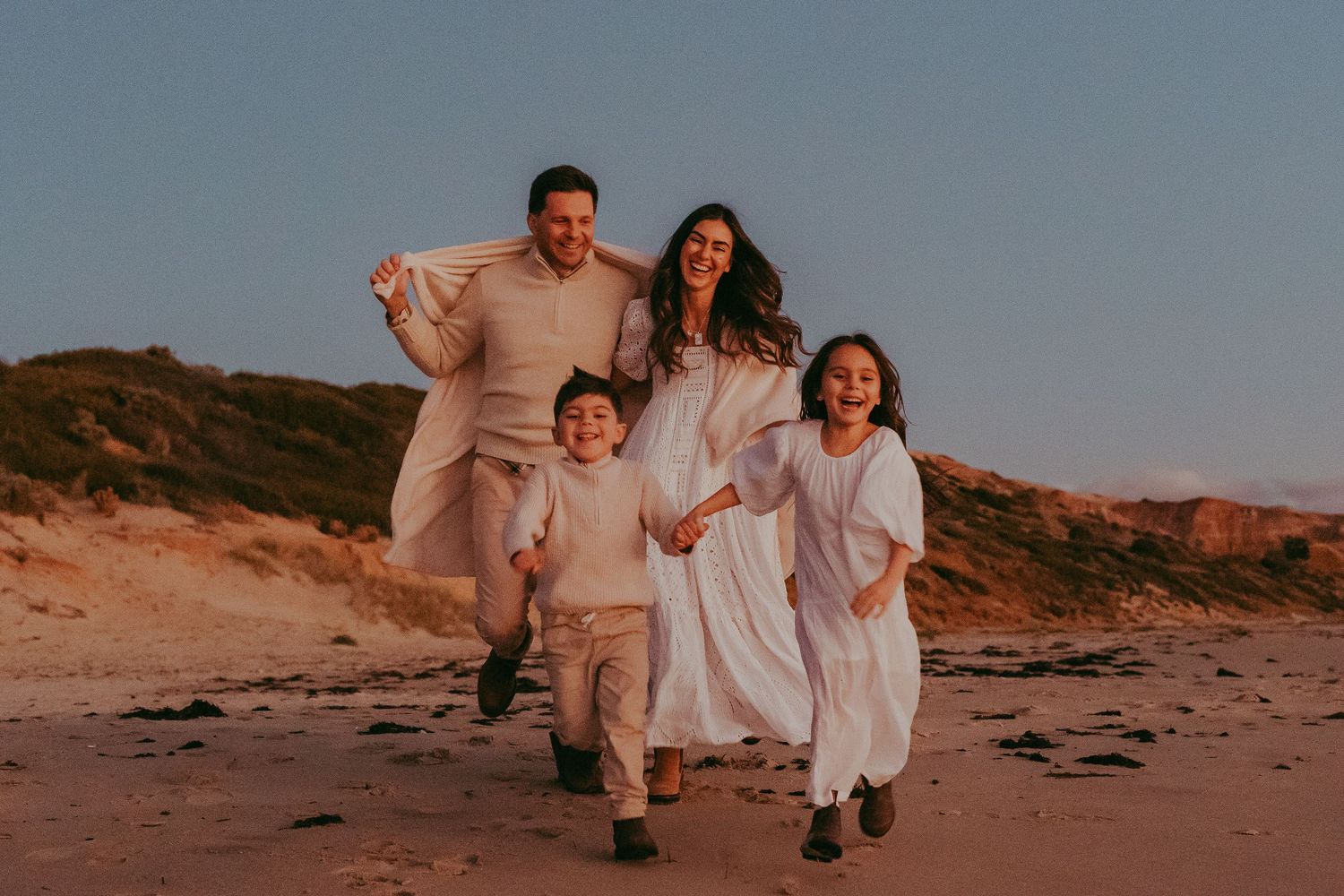 Family running along the beach at sunset in Adelaide, South Australia – Raised by Water Photography