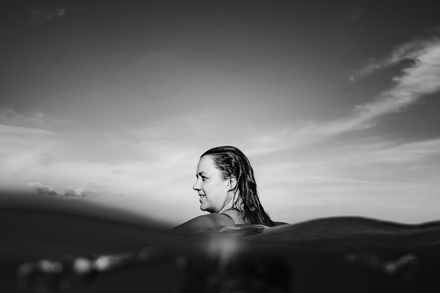 Black and white images of lady standing in the ocean.  Adelaide, South Australia