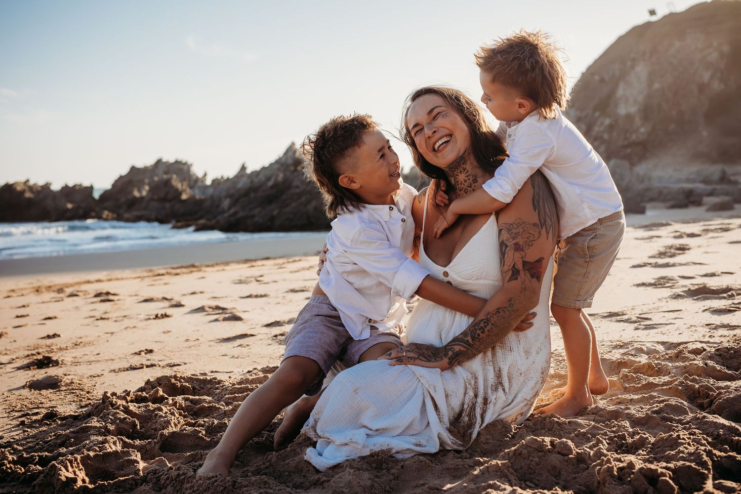 Mum and sons on the beach hugging and laughing.  Family lifestyle photographer.  Adelaide, South Australia