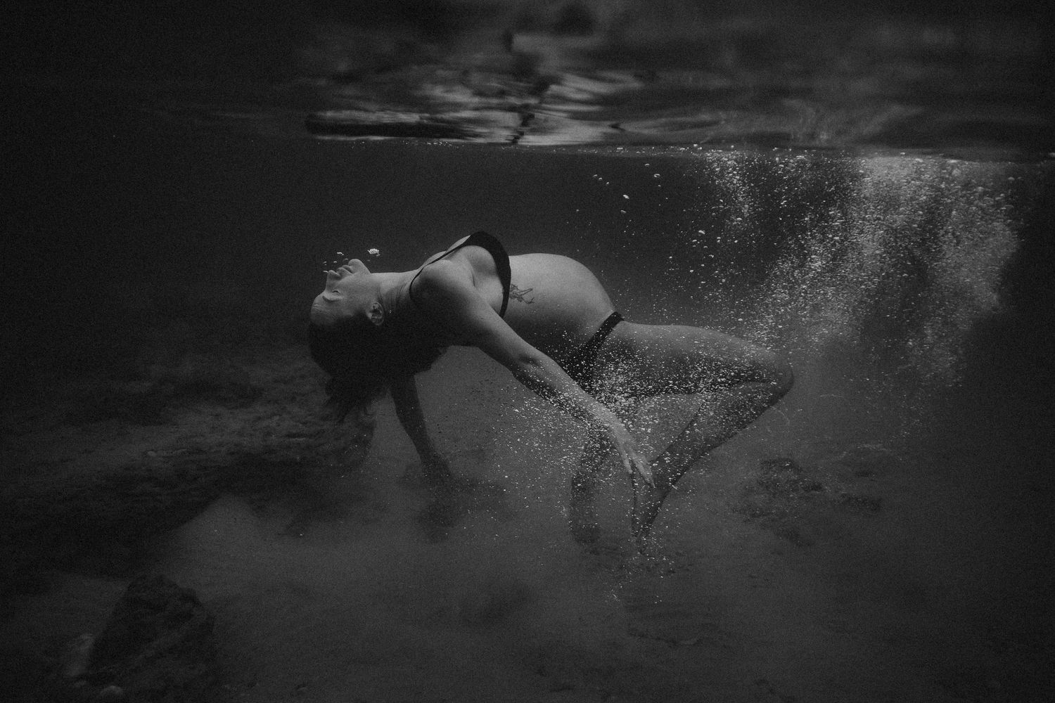 Serene underwater maternity-inspired photo of woman floating in ocean – South Australia Underwater maternity photographer