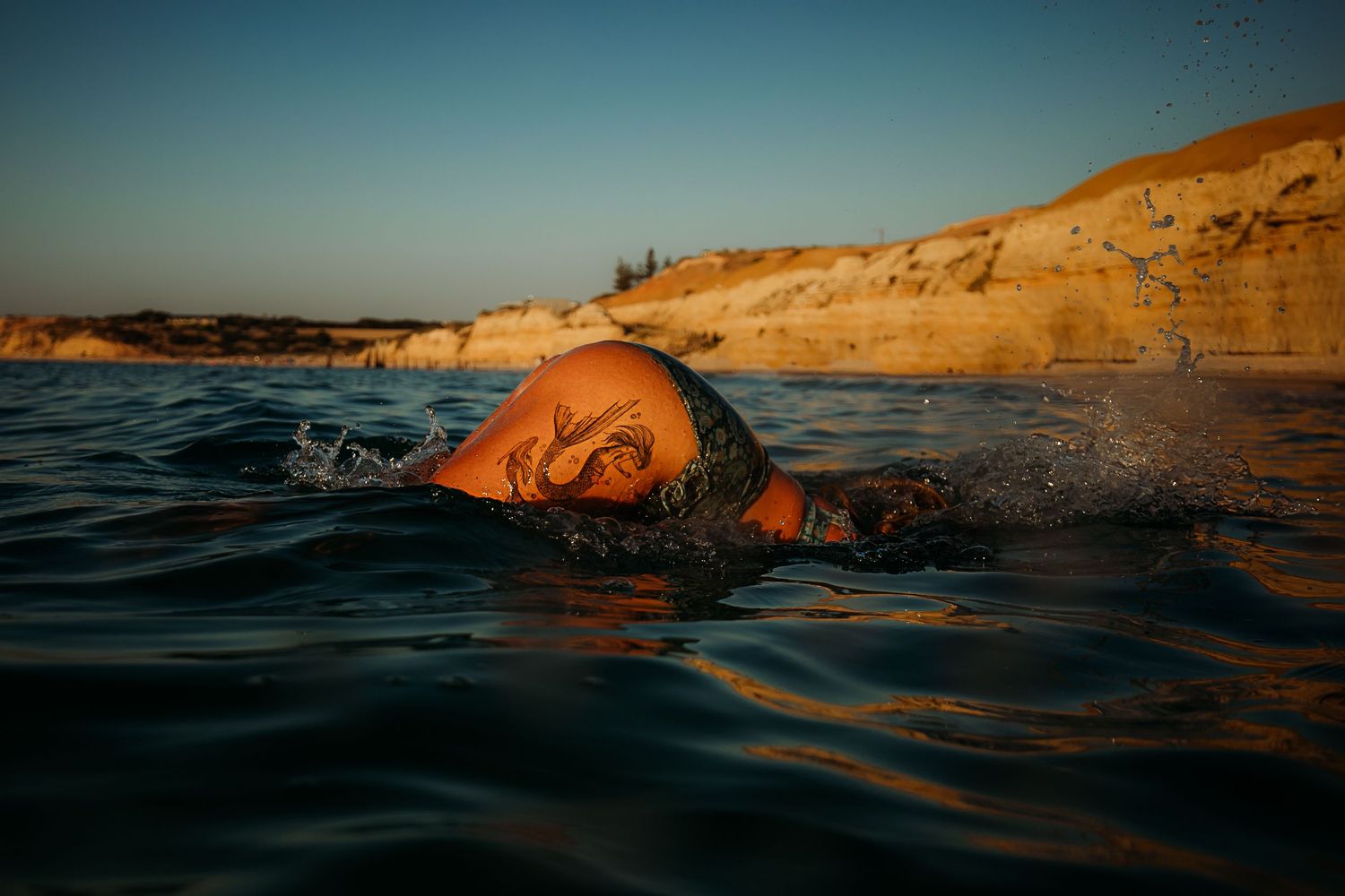 Woman diving gracefully into clear ocean waters – Raised by Water Photography, Adelaide