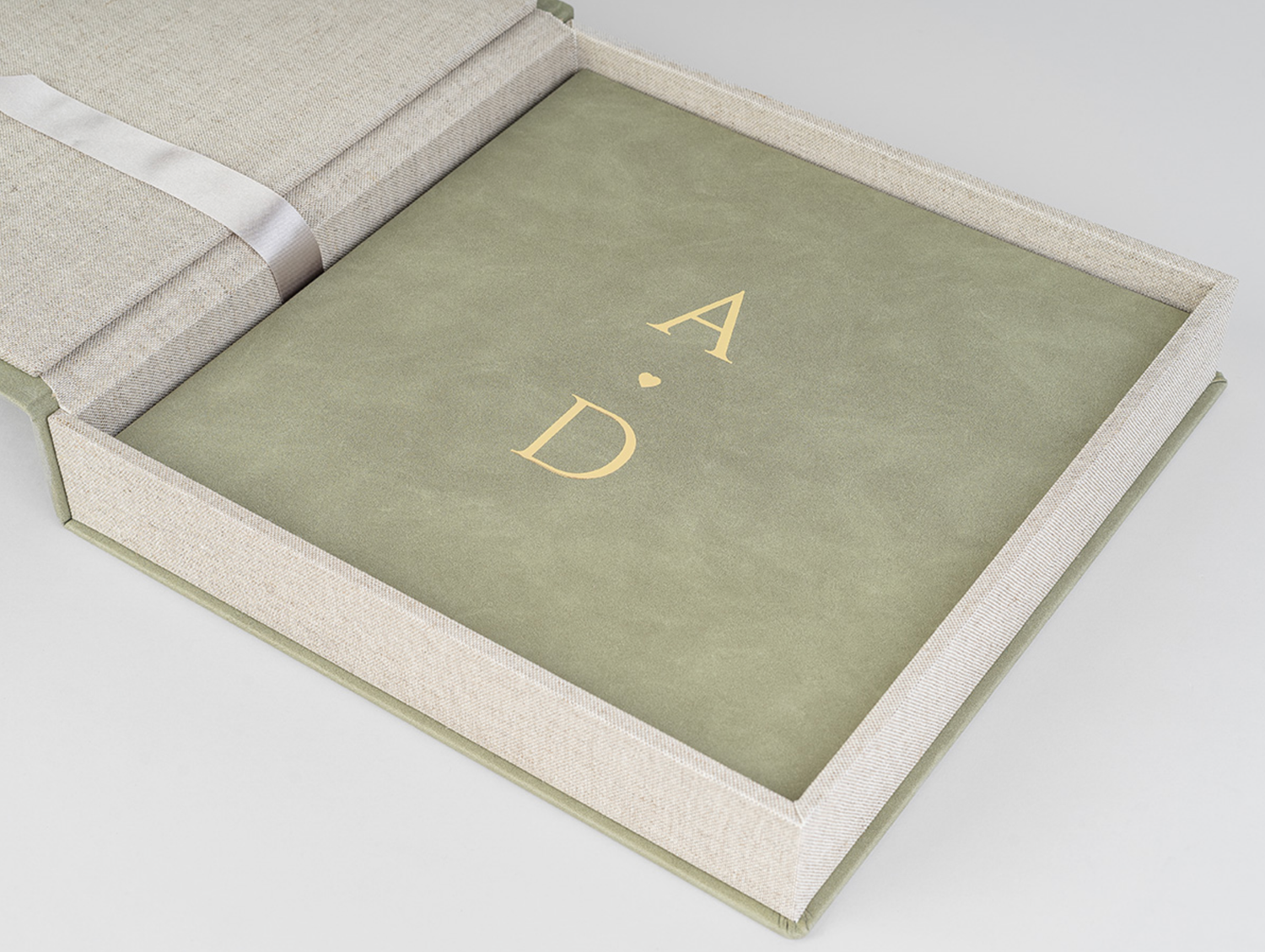 Series of minimalist book covers or album pages in soft sage green and beige tones.