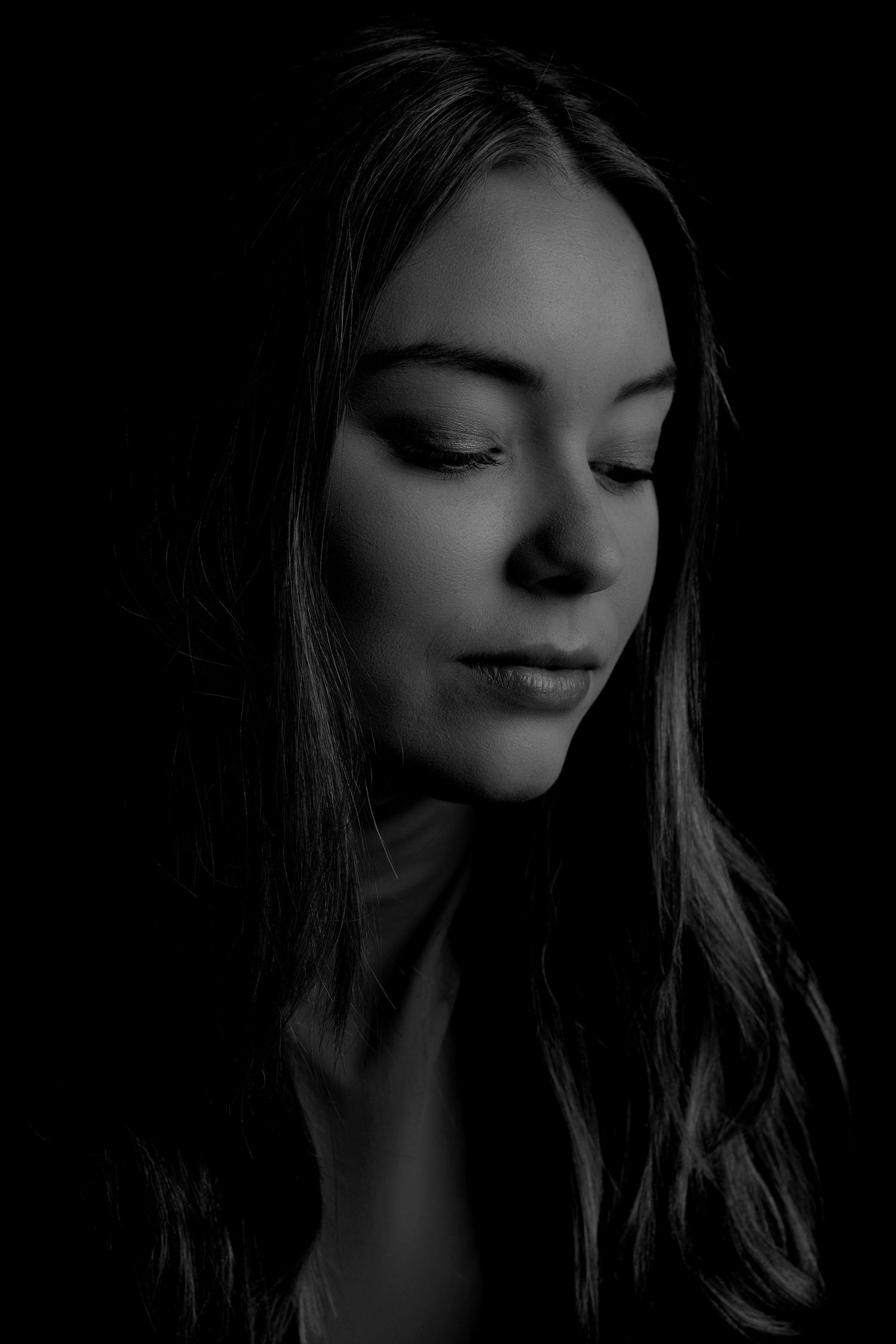Artistic black and white close-up portraits showing contemplative expressions.