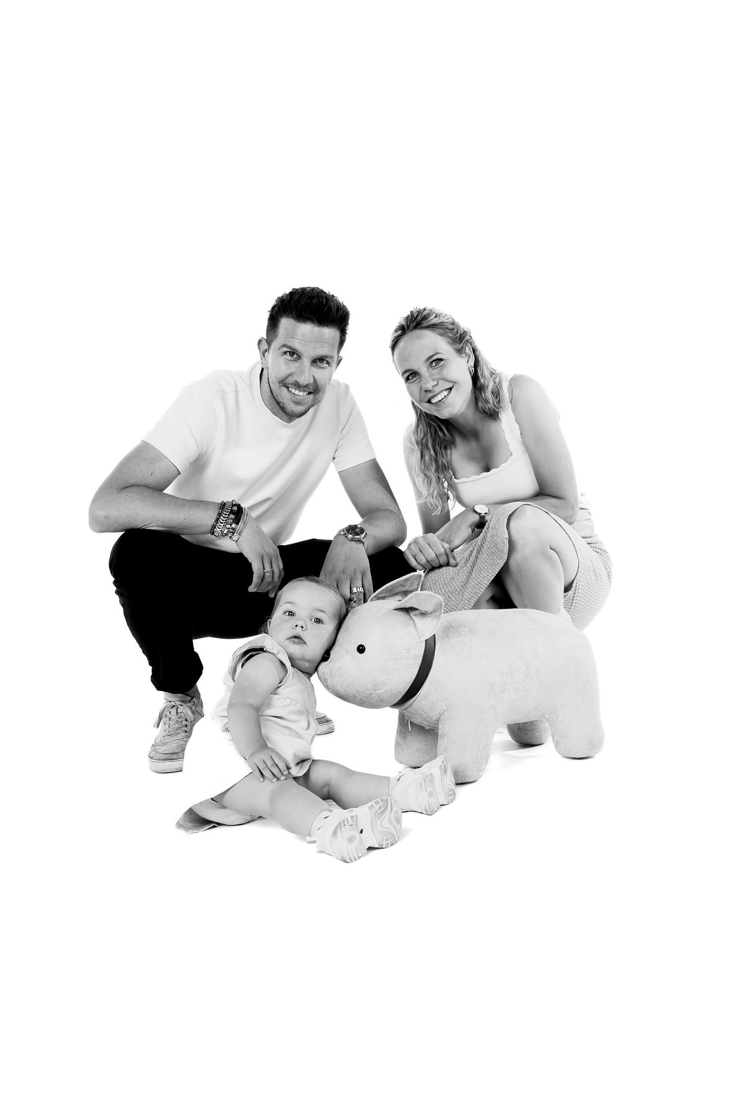 Black and white photo series showing playful poses against white background.
