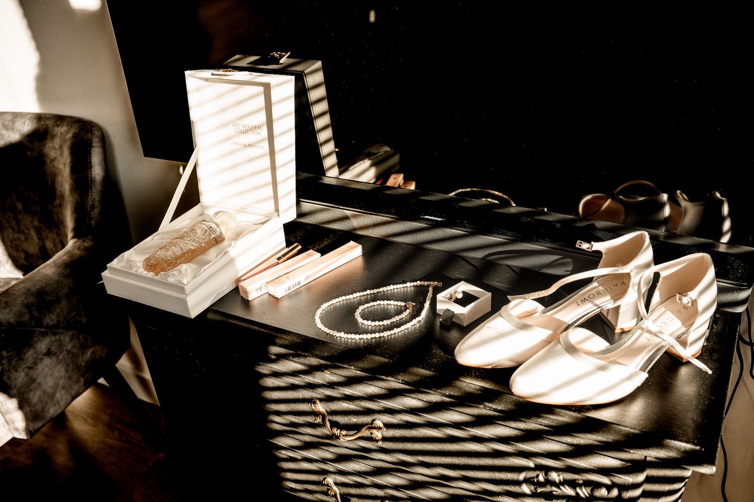 Collection of formal shoes arranged on black and white checkered surface.
