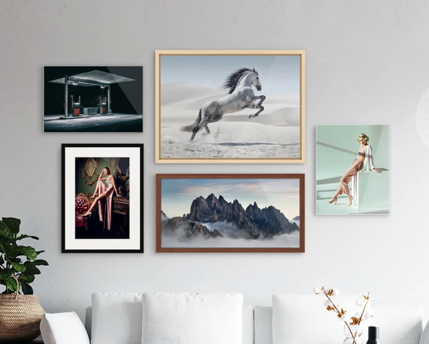 Gallery wall featuring framed surf and landscape photography in modern interior setting.