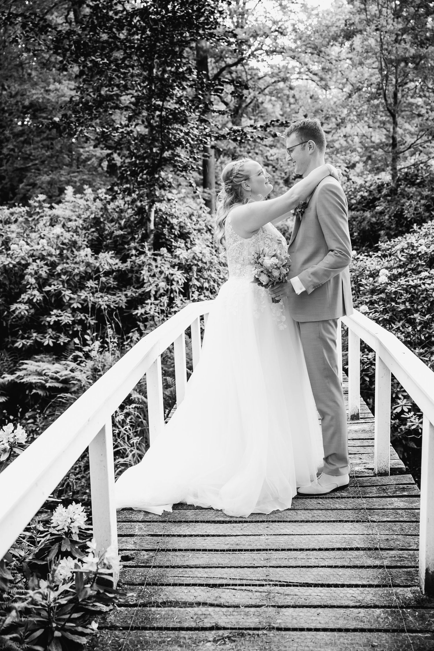 A series of black and white photos showing a couple dancing on outdoor steps.