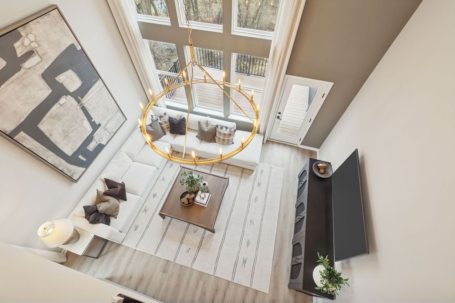 Stunning three-story home with a slab foundation. High shot of the living room