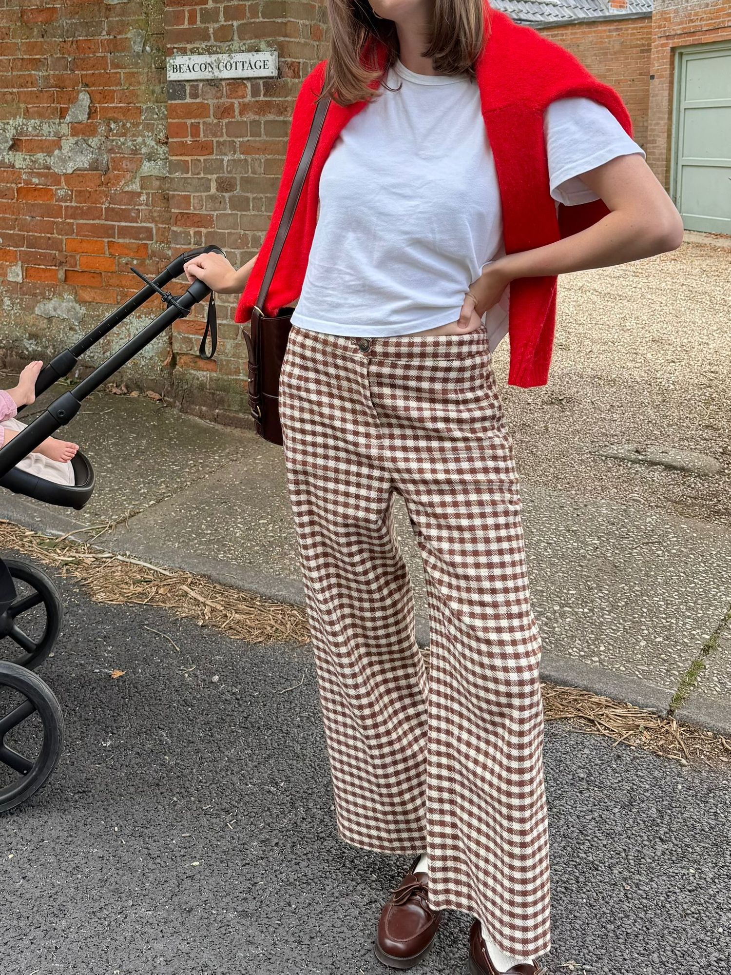 Four sequential photos showing brown and white gingham wide-leg pants styled with a red cardigan and white top.