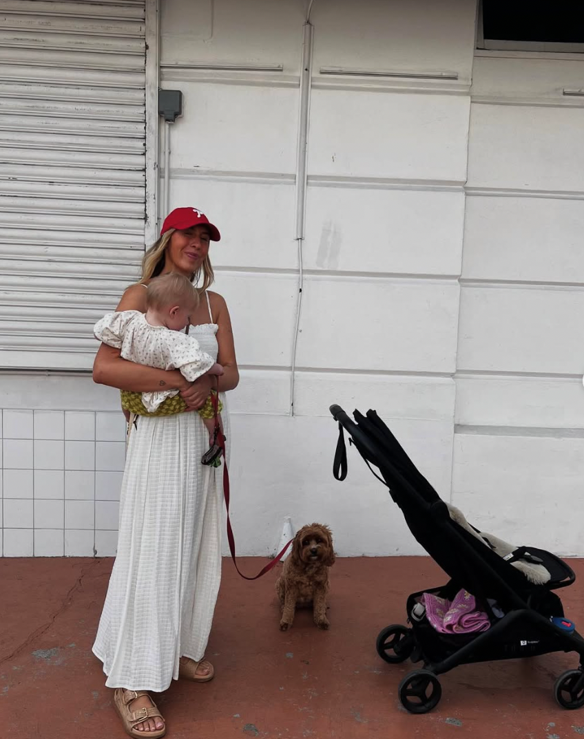 A sequence of images showing someone in a white dress walking a small brown dog next to a white building wall.