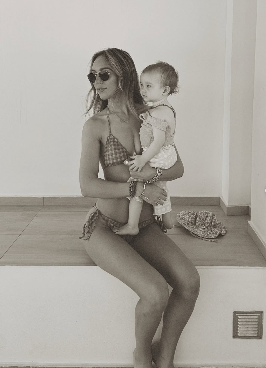 A series of black and white photos showing a parent and small child sitting together on a tiled floor.