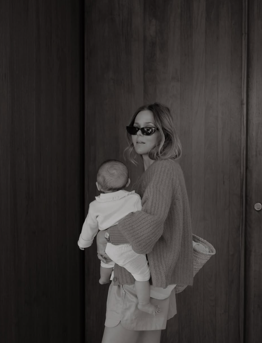 A sequence of black and white photographs showing a parent embracing a small child against a dark wooden door.
