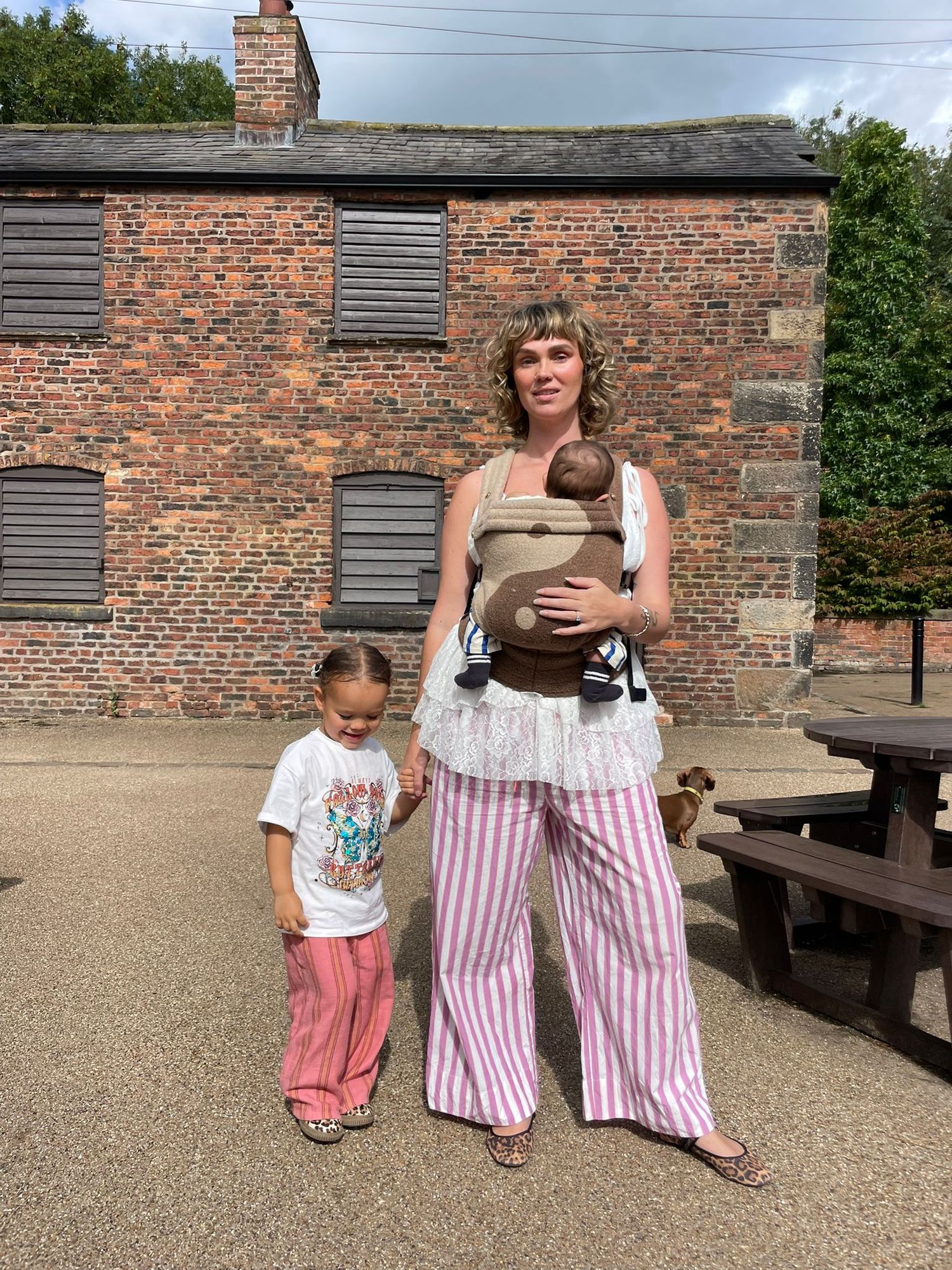 A series of candid moments showing people sitting on wooden benches against a brick wall on a sunny day.