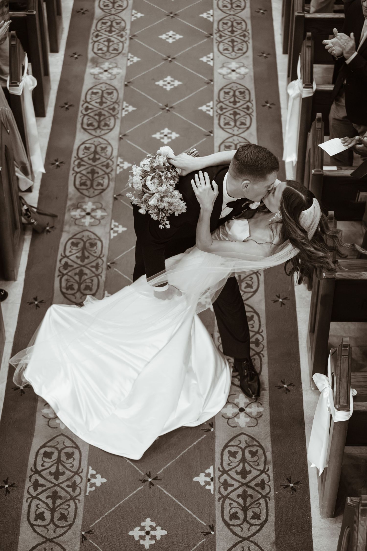 Bride and groom kissing on their wedding day.