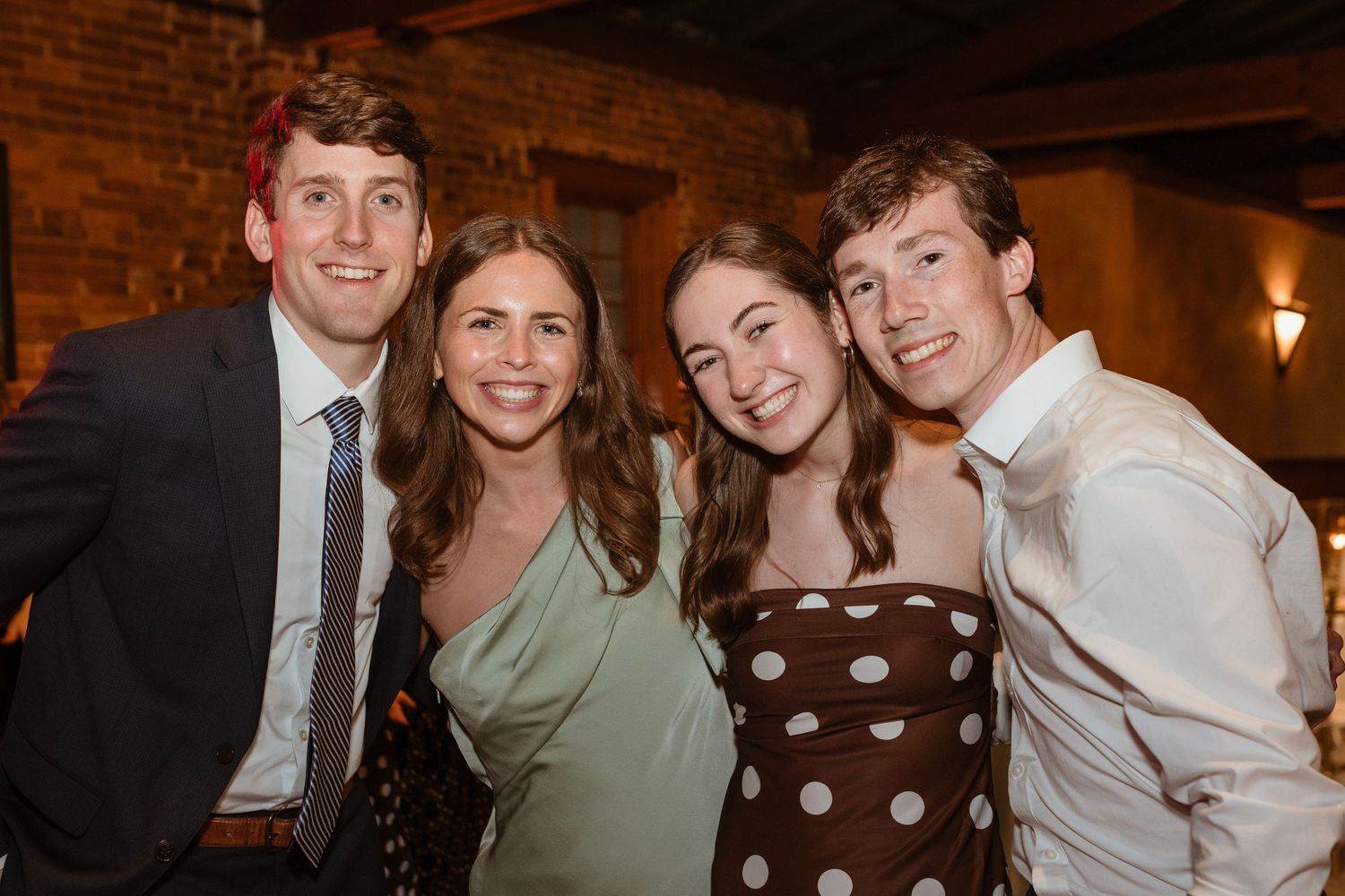 Flash photo of a group of wedding guests.