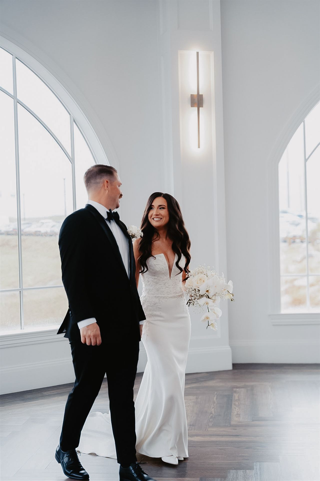 Elegant first look between bride and groom at luxury estate wedding in Bethlehem, PA — captured in soft, bright natural light with an editor