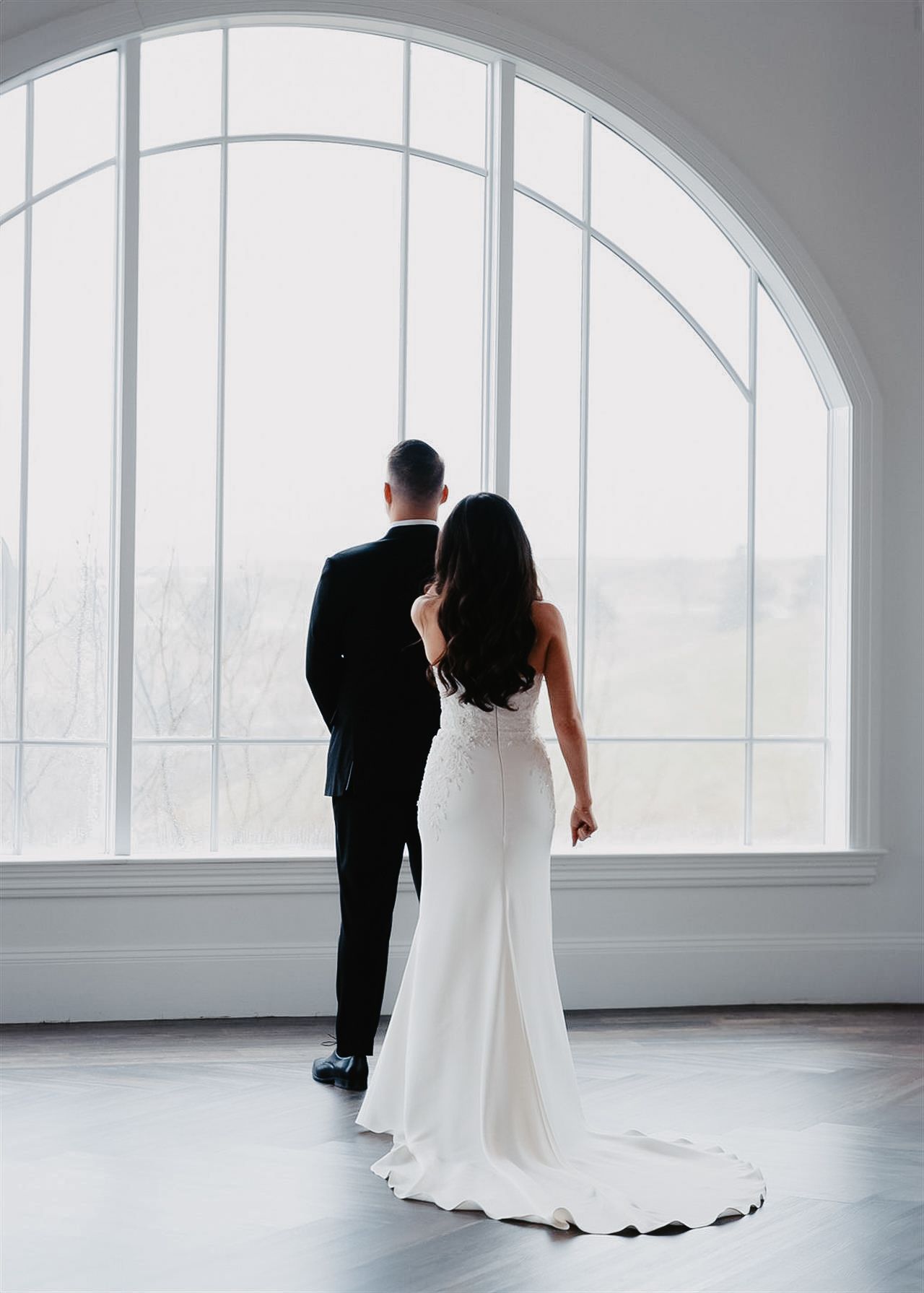 Elegant first look between bride and groom at luxury estate wedding in Bethlehem PA captured in soft, bright natural light with an editor