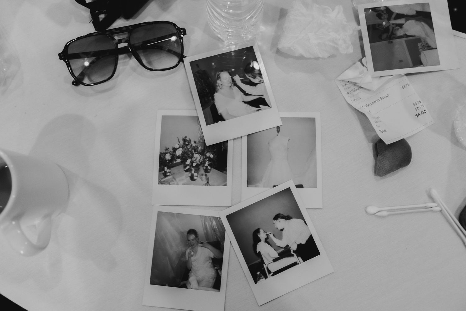 Documentary flat-lay of photos, sunglasses and cups on linen in Lehigh Valley Wedding Photography