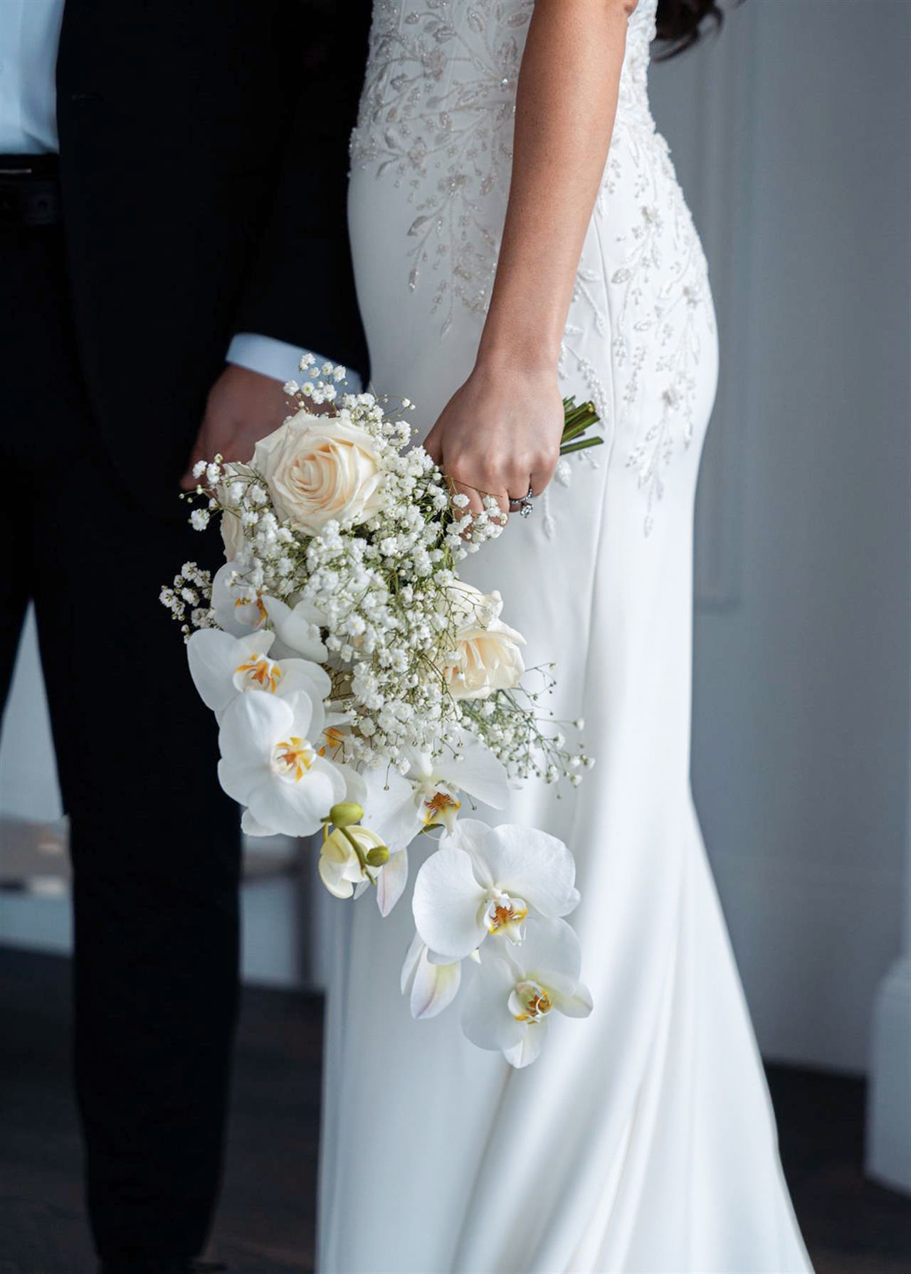 Bride holding bouquet with soft greenery and ivory blooms in Eastern PA, film wedding photography in Philadelphia