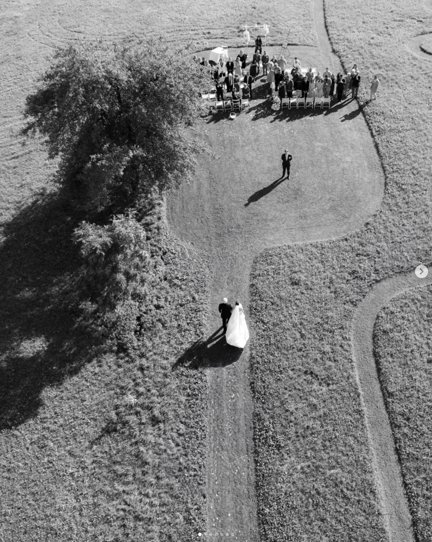 Aerial black and white photos showing a wedding ceremony setup with guests gathered outdoors.