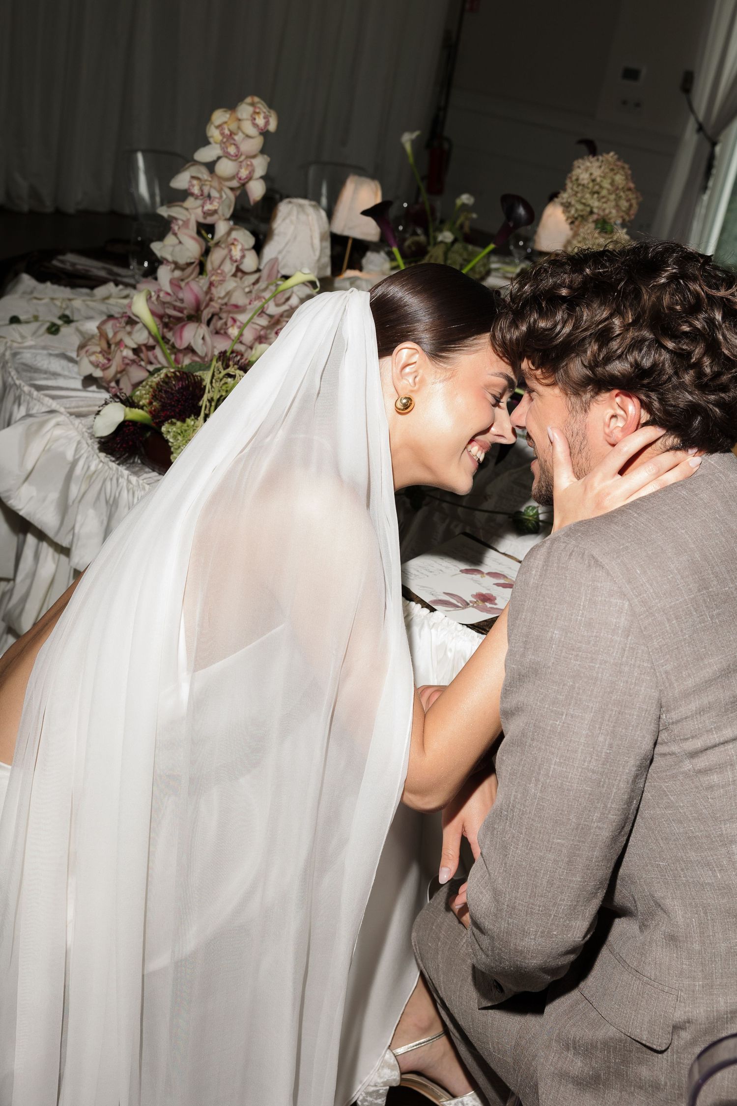 A series of candid wedding photos showing a couple in a sweet moment, with the bride wearing a veil and groom in gray suit.