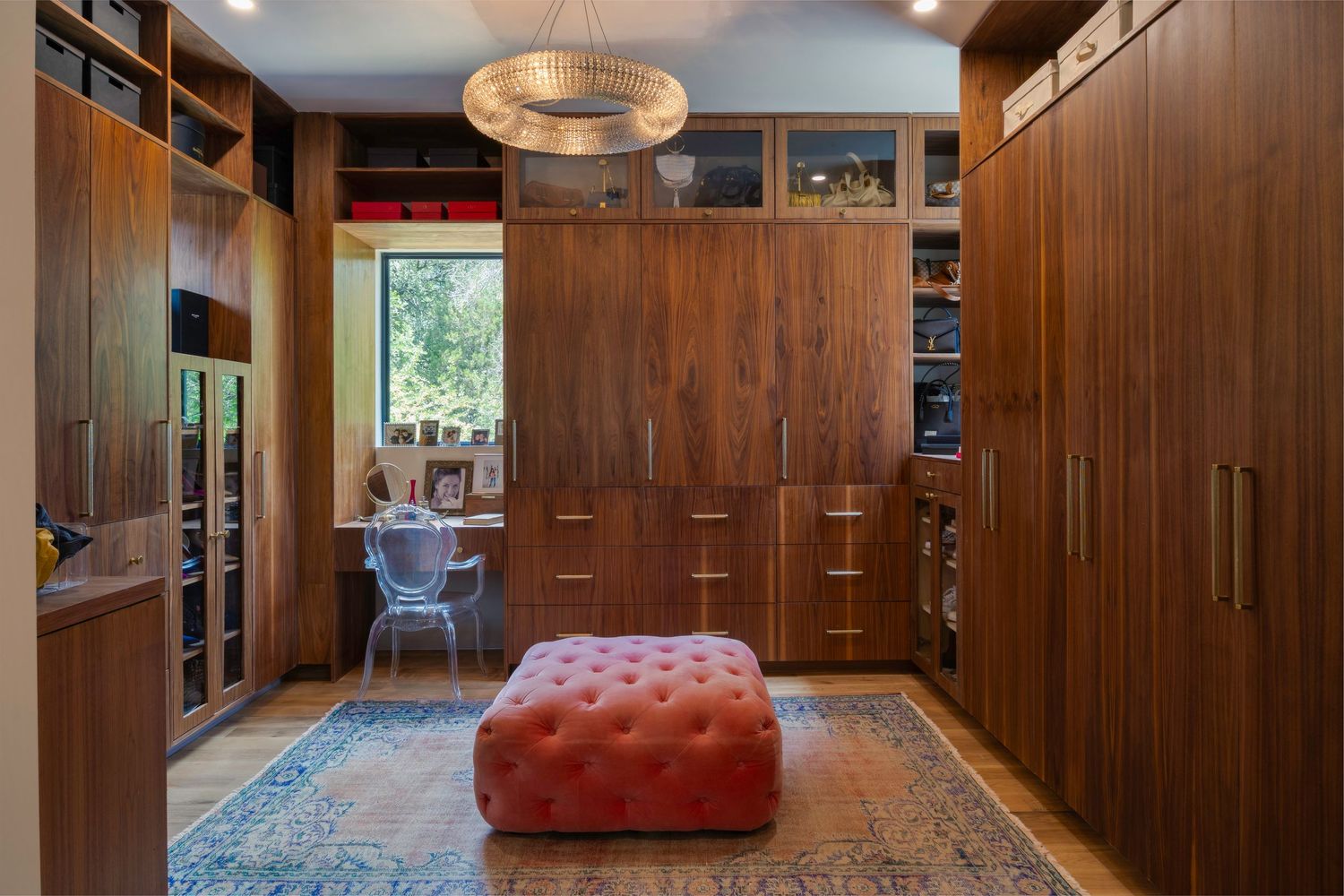 Spacious room with wood paneled walls, built-in storage, and red leather seating.