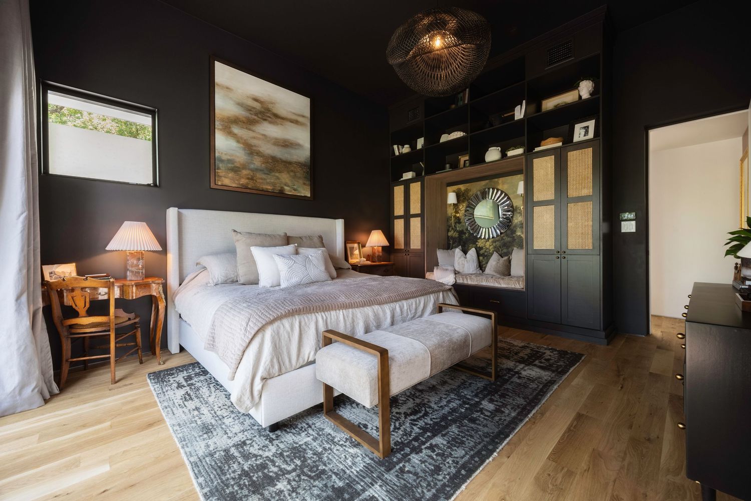 Contemporary living space with dark walls and hardwood floors featuring modern furniture and lighting.