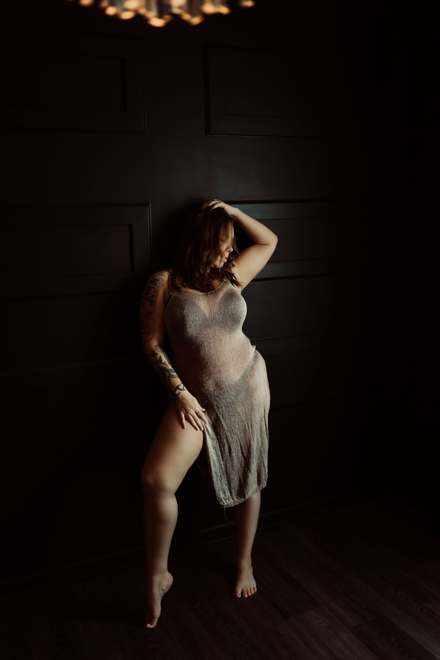 Artistic silhouette of a dancer in motion captured in a series of dark and moody photographs against a black background.