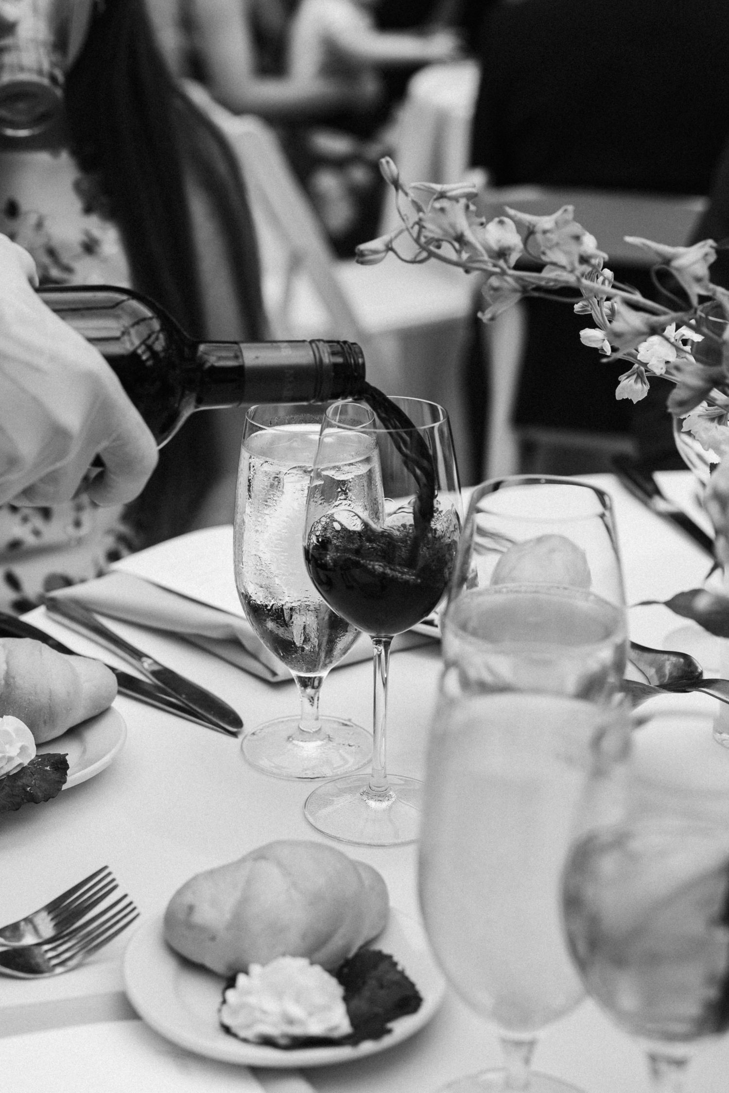Black and white table settings with wine glasses and plates show an elegant dining setup in Chicago
