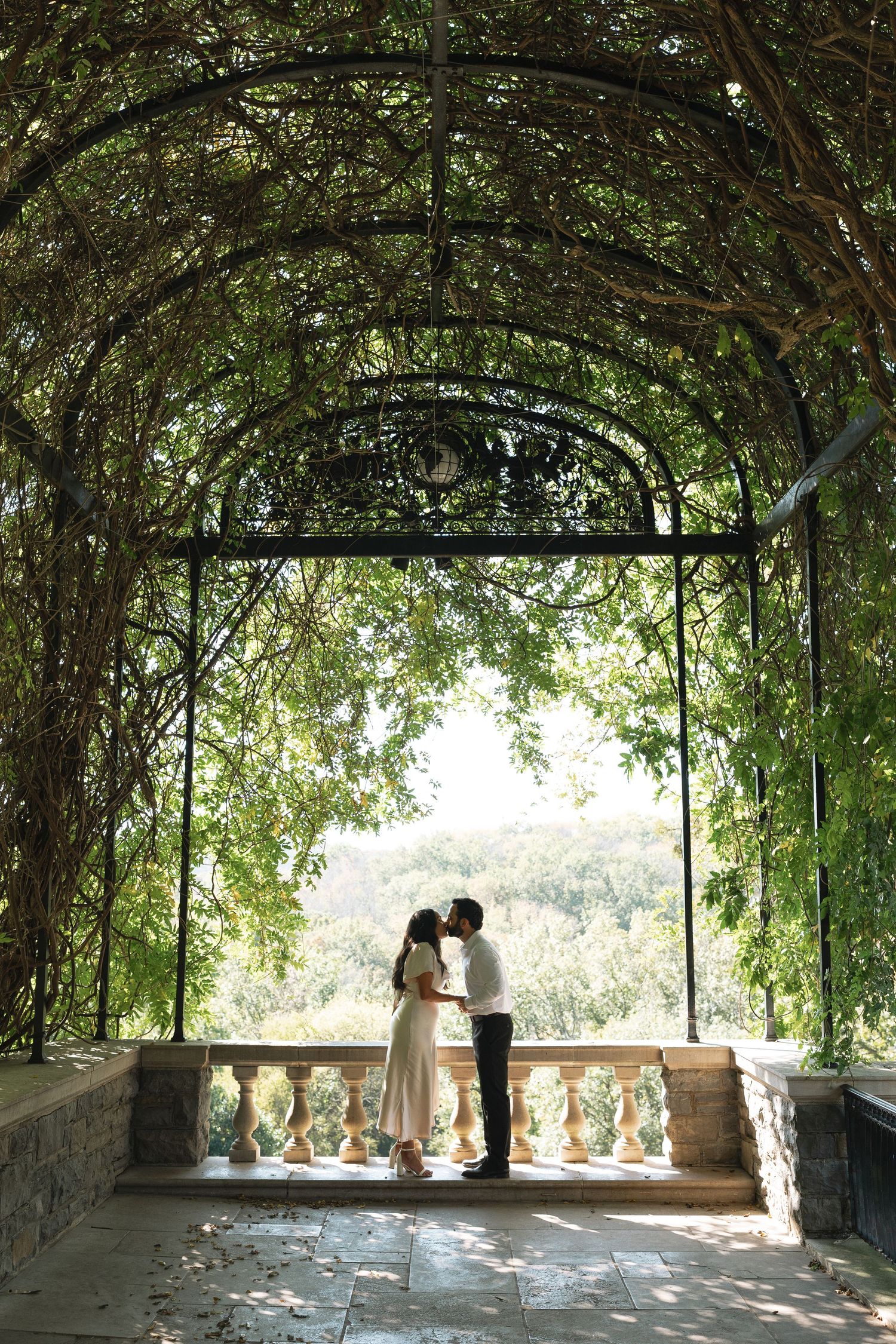 A romantic vine-covered terrace overlooks a scenic landscape at Cheekwood Estates in Nashville, Tennessee