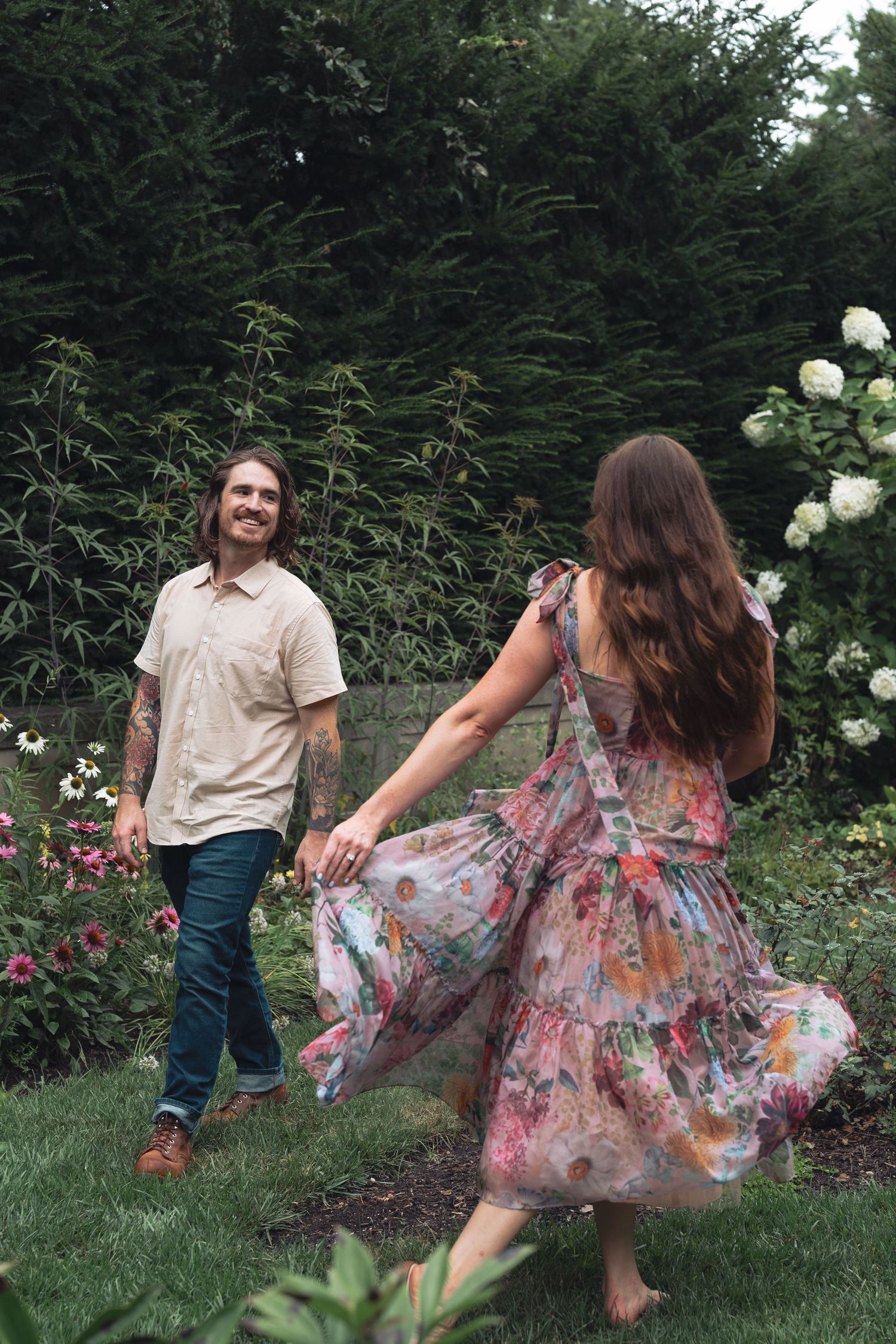 Dancing couple in a floral garden setting showcases romantic movements in Indianapolis