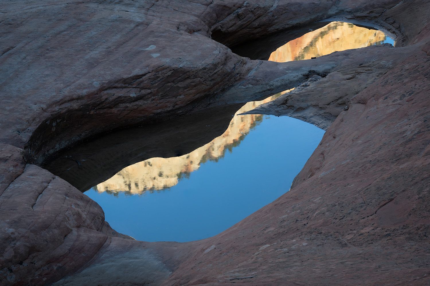 Scenic panoramic sequence of Lake Powell's blue waters and towering sandstone cliffs in the American Southwest.