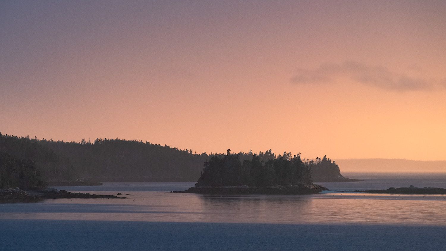 Dramatic sunset light over a group of islands in Maine.